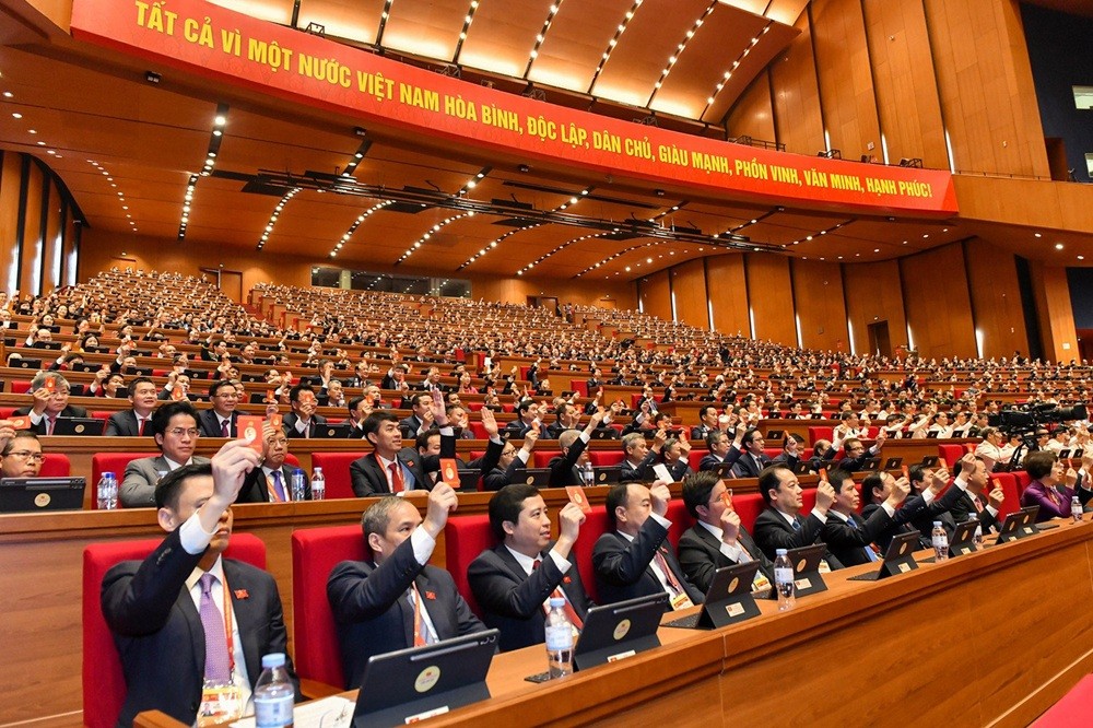 Đại biểu biểu quyết thông qua Quy chế làm việc của Đại hội XIV_Ảnh: TTXVN